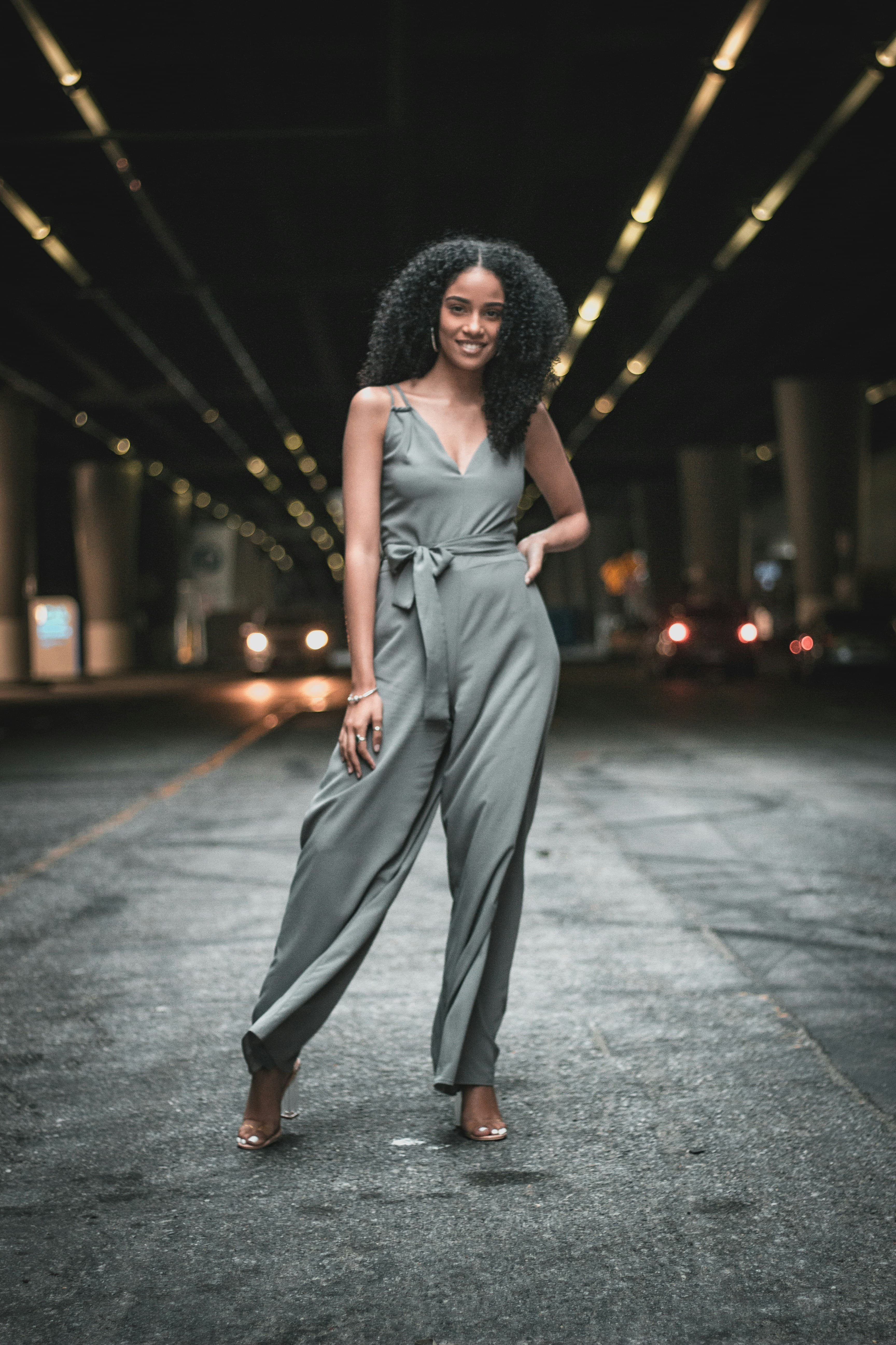 Supplied real woman model in the original grey sleeveless wrap jumpsuit